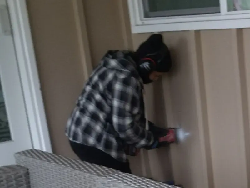 Professional electrician installing an exterior outlet in Marengo