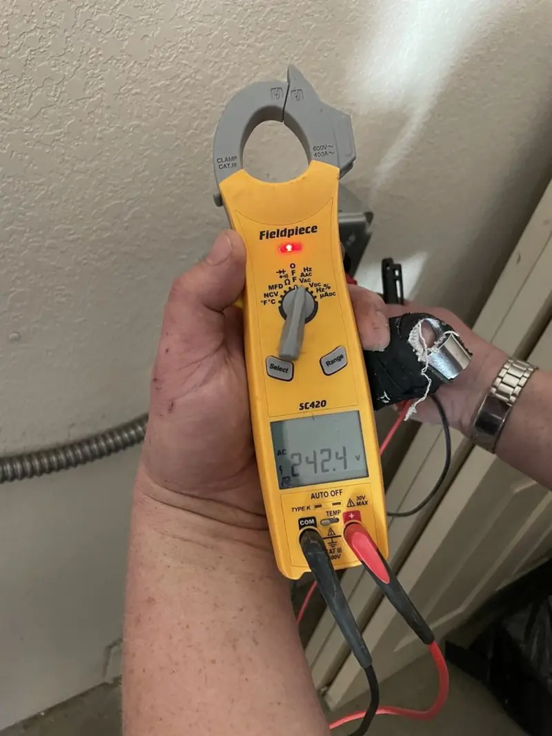 Voltage testing with clamp meter during Recessed Lighting Installation in Marengo
